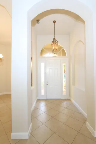 a kitchen with granite countertop white cabinets and stainless steel appliances