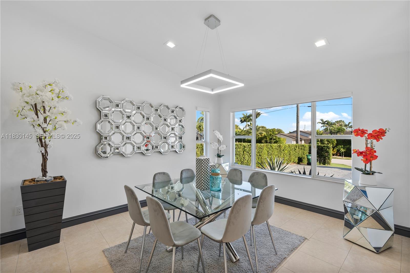 13815 Southwest 38th Street Miami, FL 33175 - Photo 12 of 75 a dining room with furniture and a floor to ceiling window