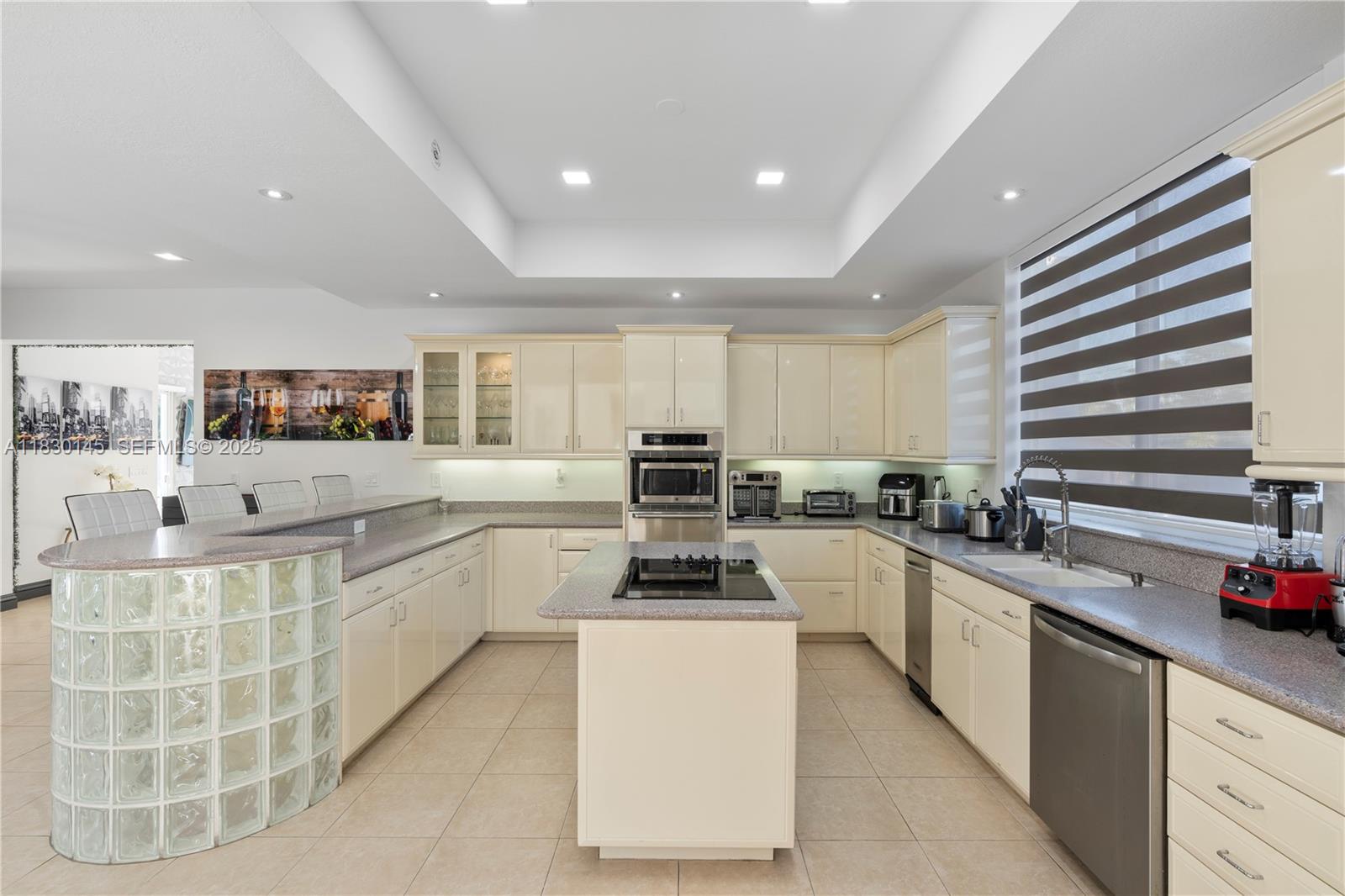 13815 Southwest 38th Street Miami, FL 33175 - Photo 17 of 75 a kitchen with counter top space cabinets and stainless steel appliances