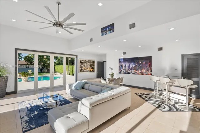 a view of an house with backyard porch and sitting area