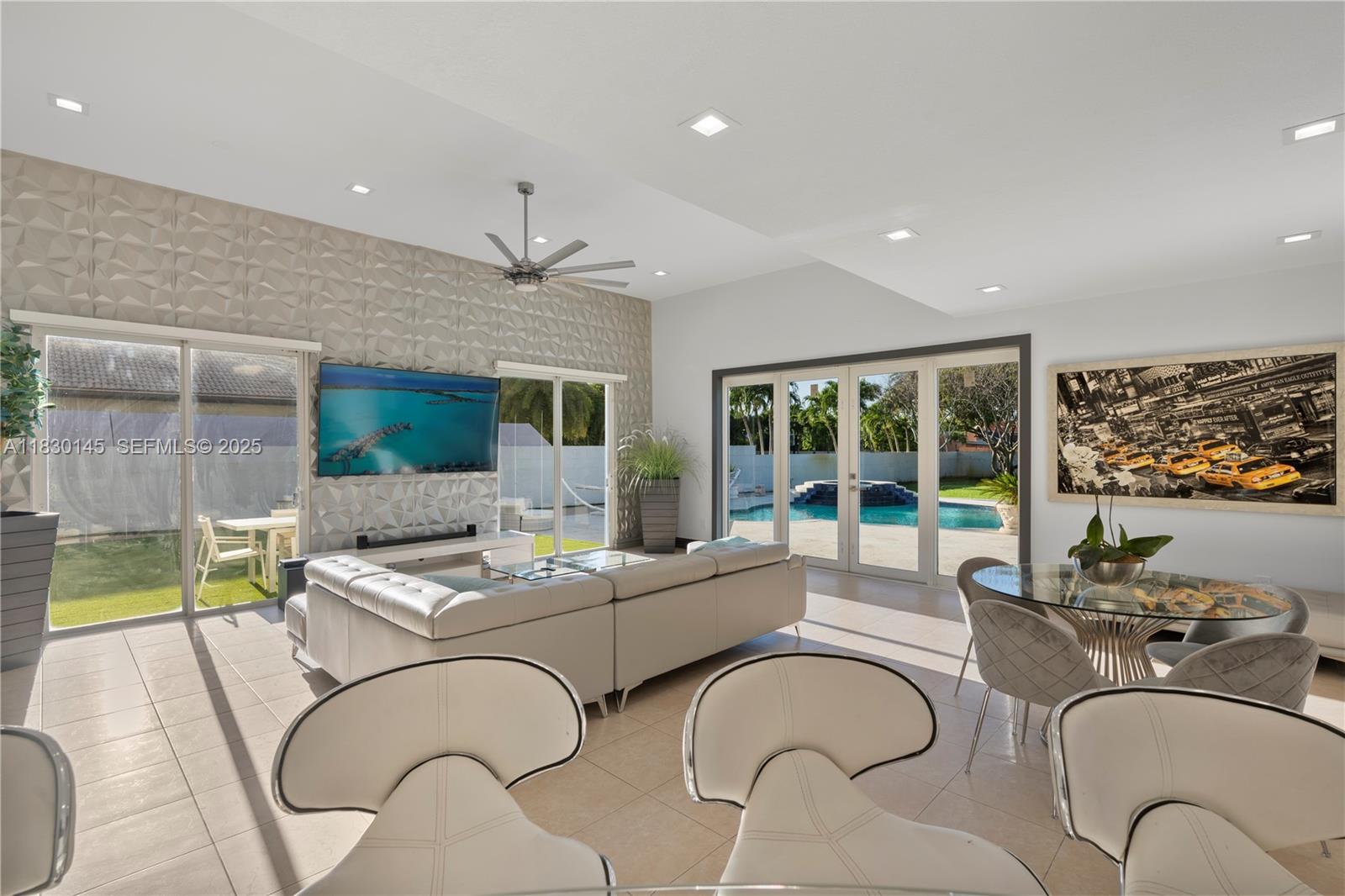 13815 Southwest 38th Street Miami, FL 33175 - Photo 21 of 75 a living room with patio furniture and a large window