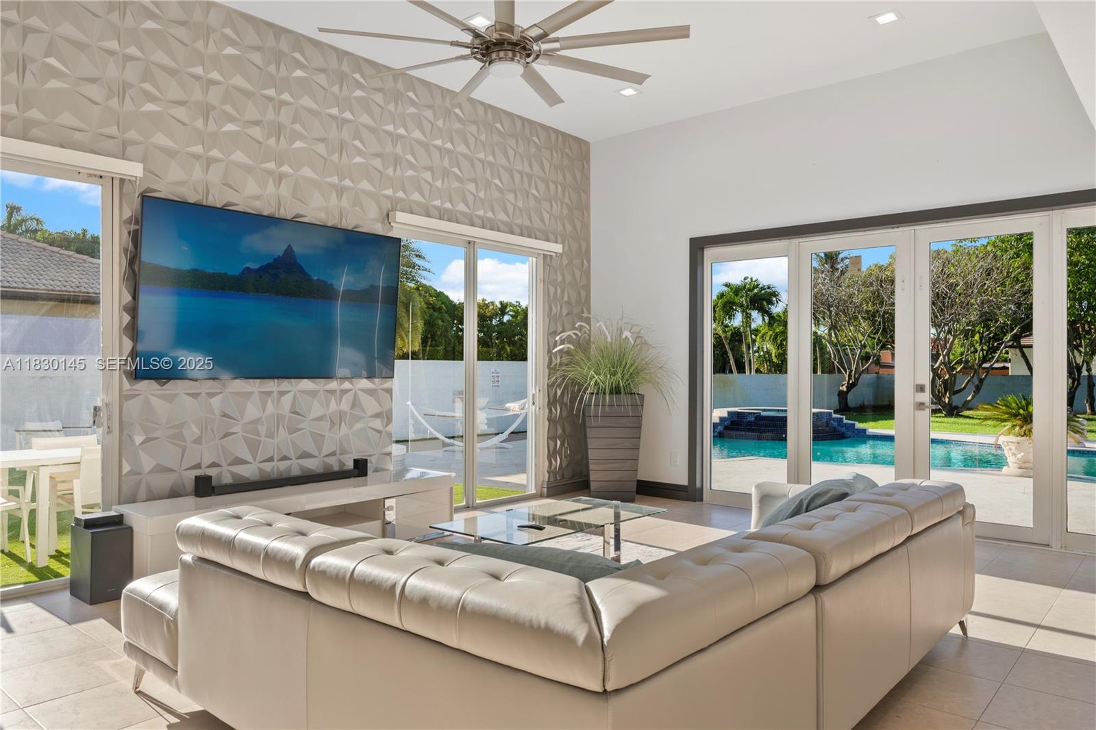 13815 Southwest 38th Street Miami, FL 33175 - Photo 22 of 75 a living room with couch and a large window