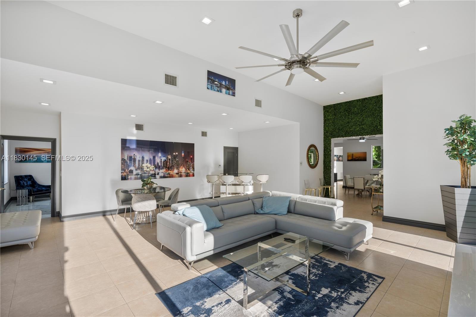 13815 Southwest 38th Street Miami, FL 33175 - Photo 24 of 75 a living room with furniture a ceiling fan and a rug