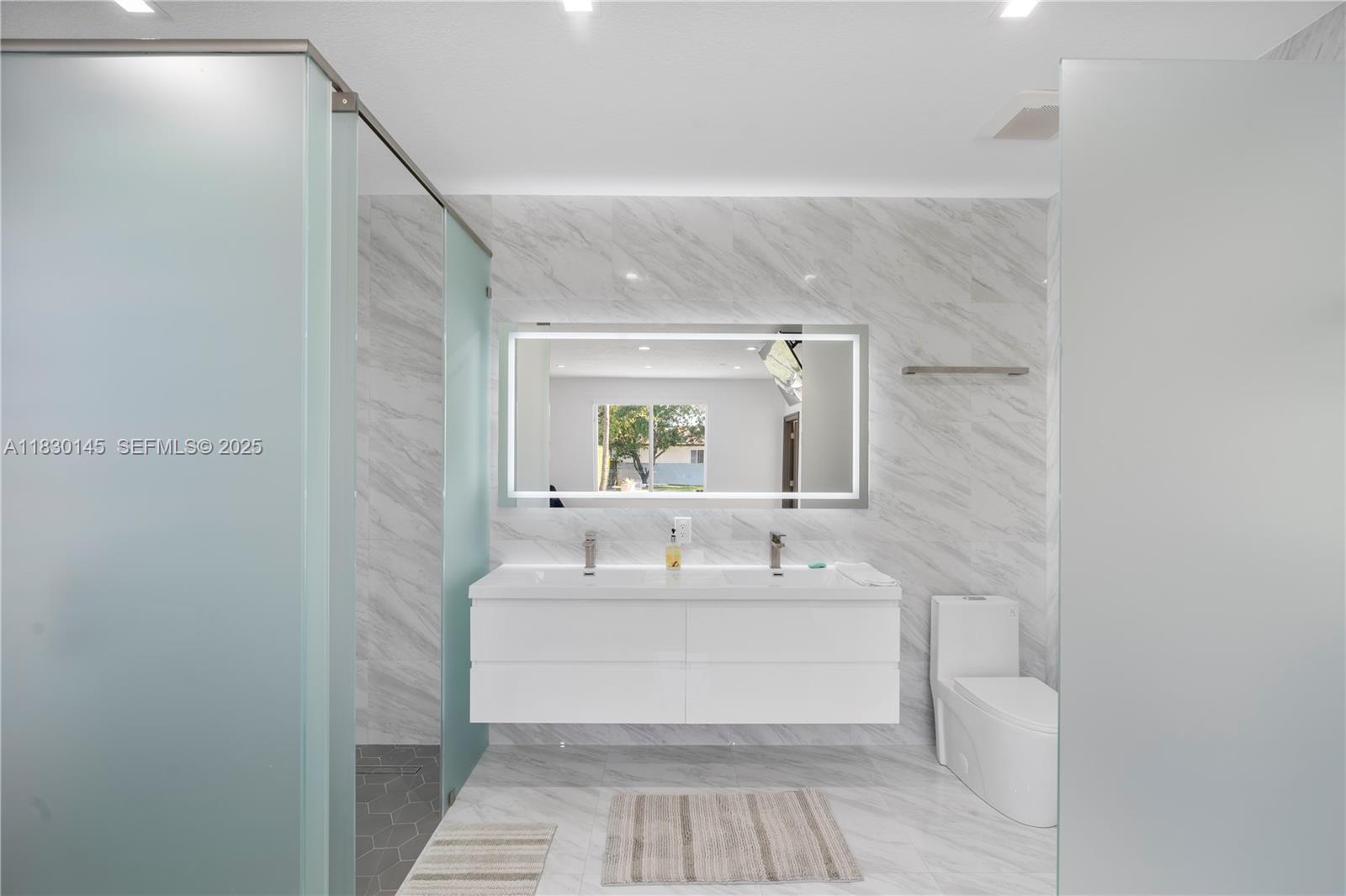 13815 Southwest 38th Street Miami, FL 33175 - Photo 26 of 75 a bathroom with a sink and a mirror