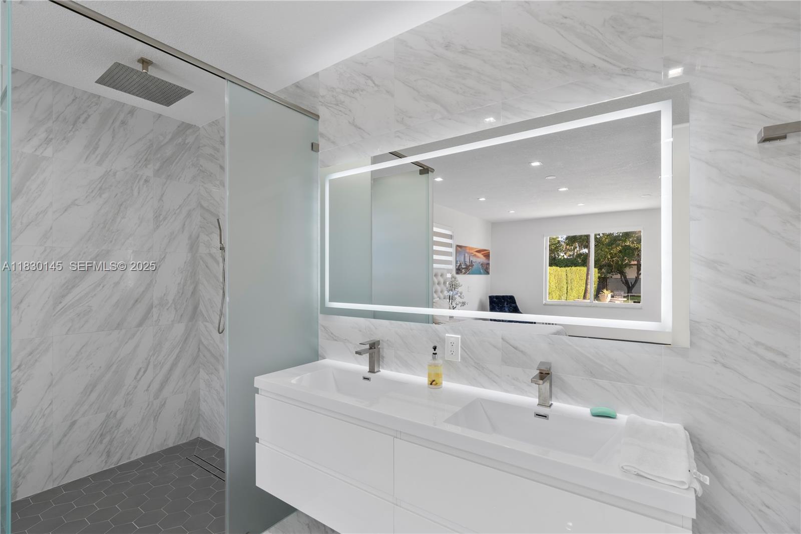 13815 Southwest 38th Street Miami, FL 33175 - Photo 27 of 75 a bathroom with a sink and a mirror