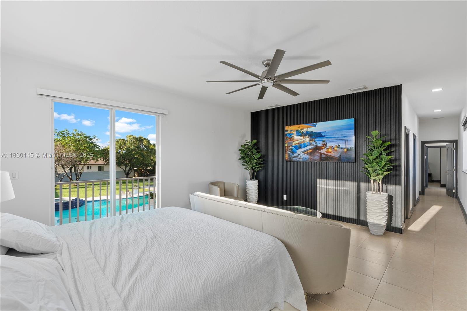 13815 Southwest 38th Street Miami, FL 33175 - Photo 28 of 63 a bedroom with a bed and a flat screen tv