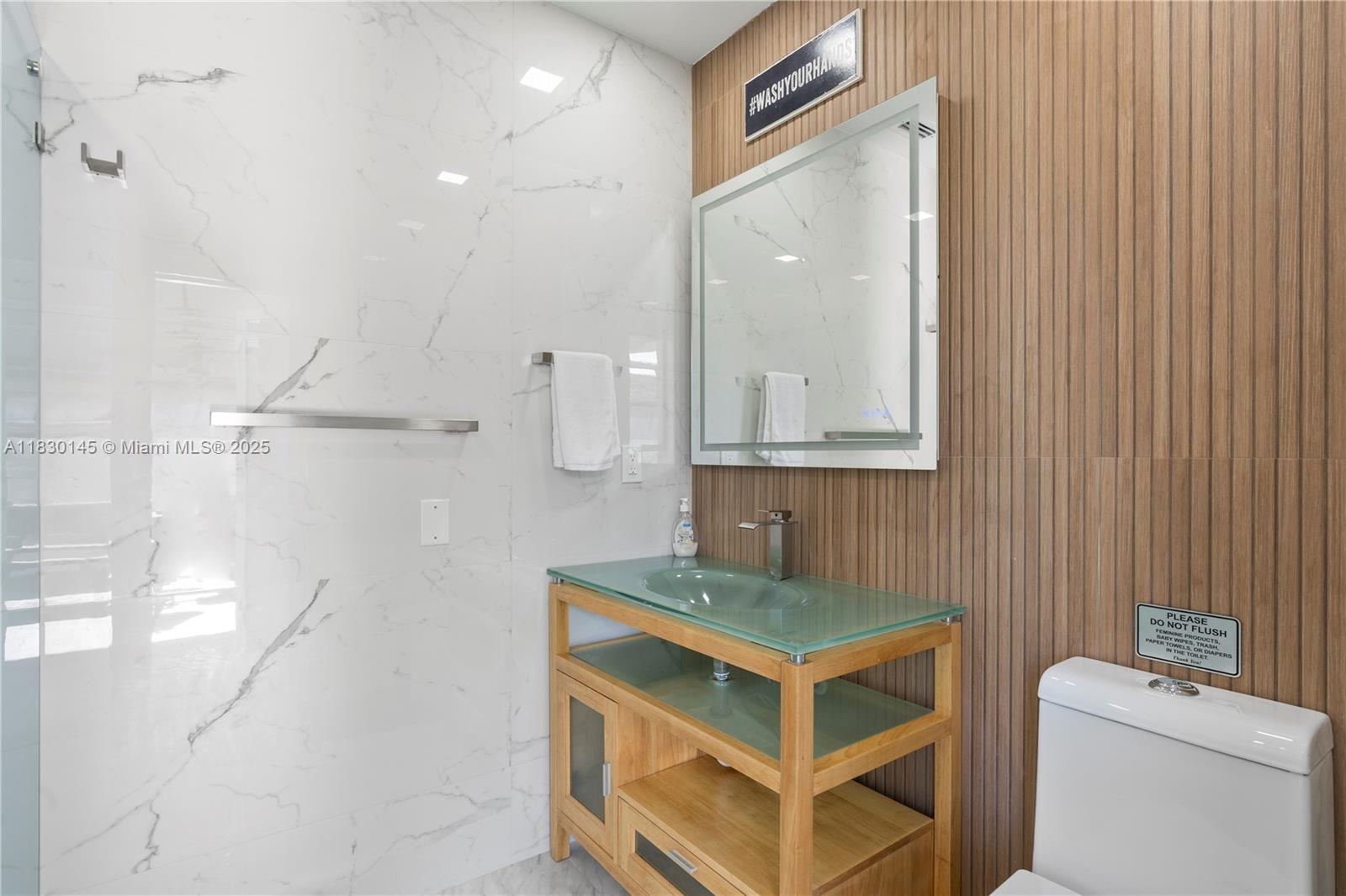 13815 Southwest 38th Street Miami, FL 33175 - Photo 32 of 63 a bathroom with a sink a toilet and a mirror