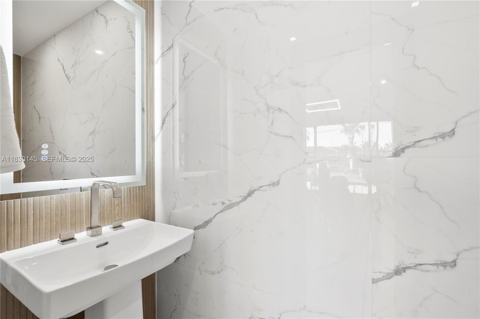 13815 Southwest 38th Street Miami, FL 33175 - Photo 33 of 75 a bathroom with a sink and a mirror