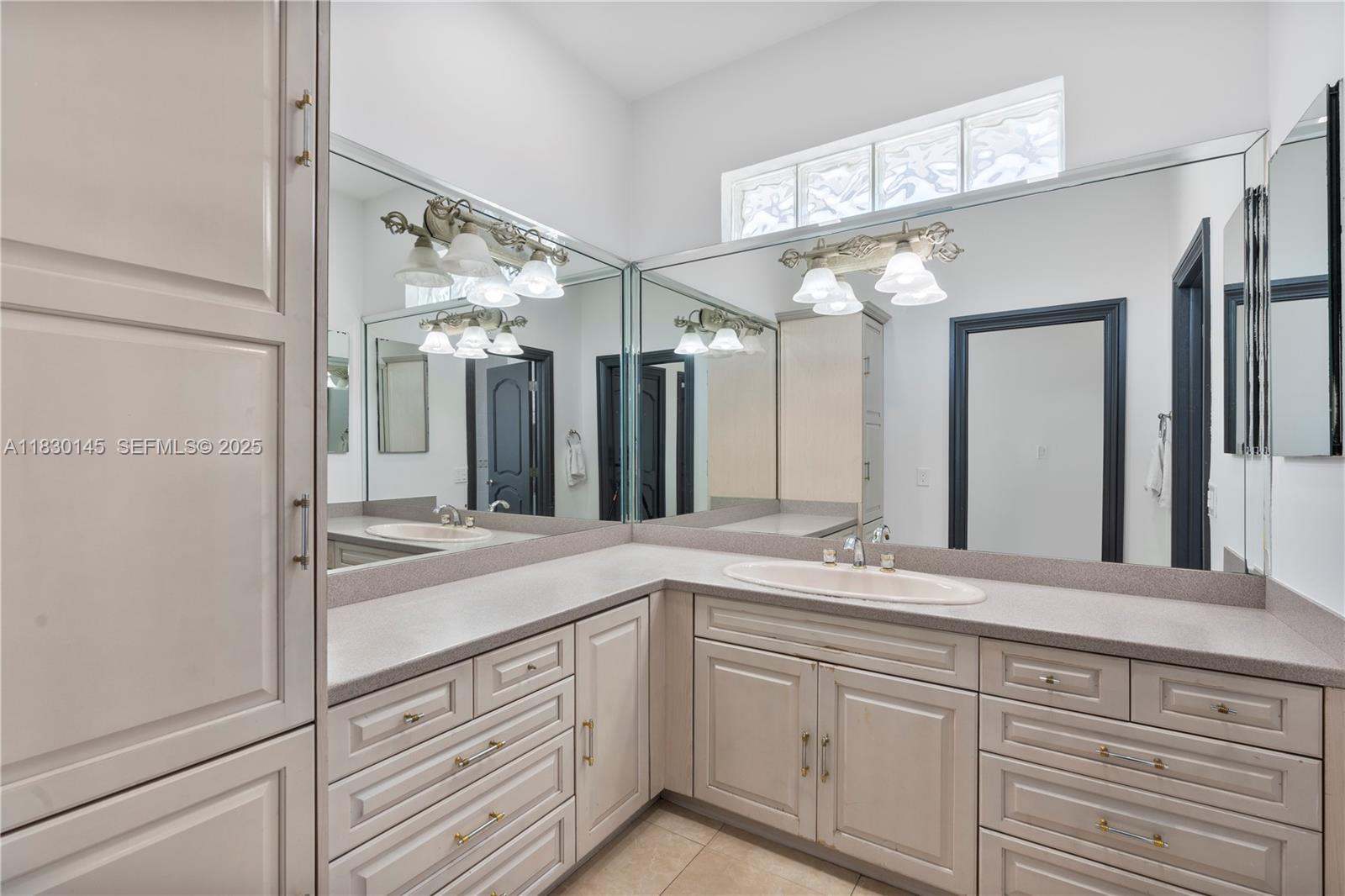 13815 Southwest 38th Street Miami, FL 33175 - Photo 40 of 75 a bathroom with a sink and a mirror