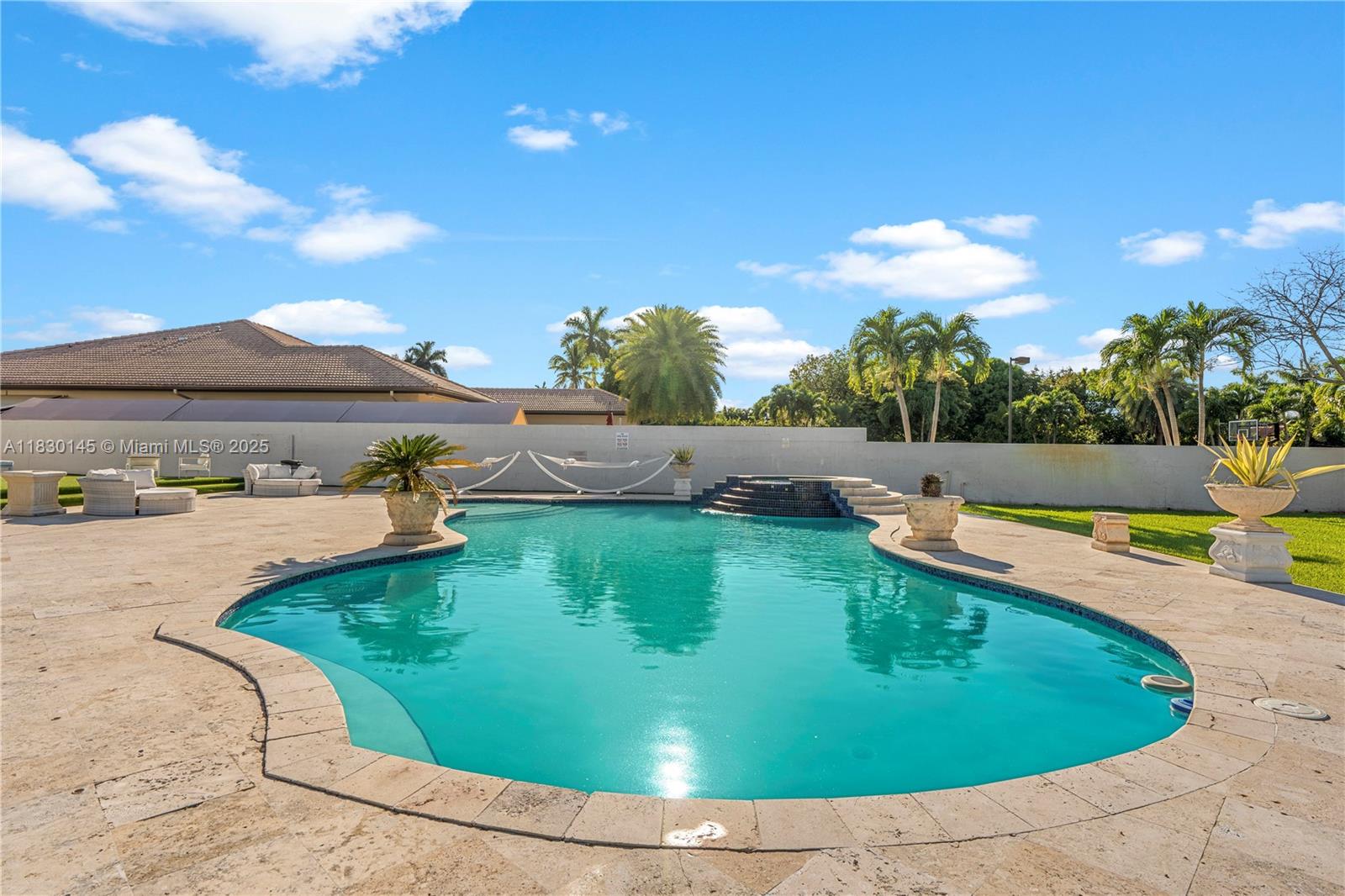 13815 Southwest 38th Street Miami, FL 33175 - Photo 55 of 63 a view of a swimming pool with an outdoor seating