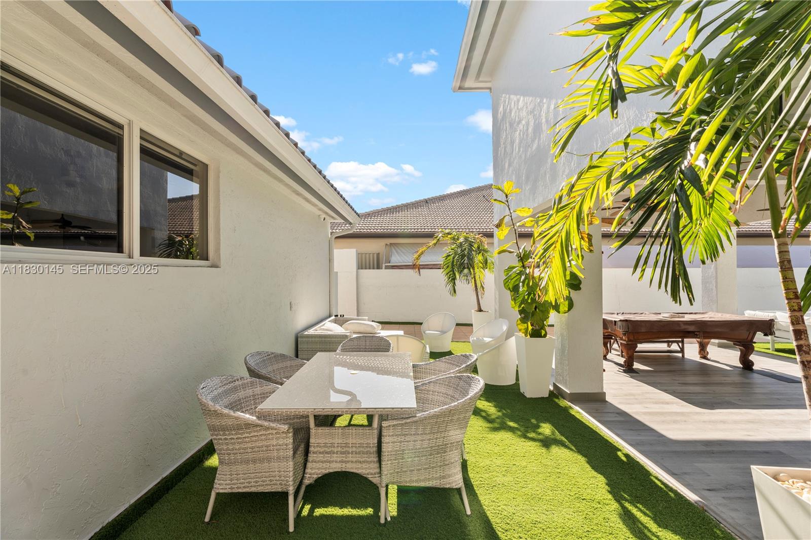 13815 Southwest 38th Street Miami, FL 33175 - Photo 58 of 75 a balcony with table and chairs