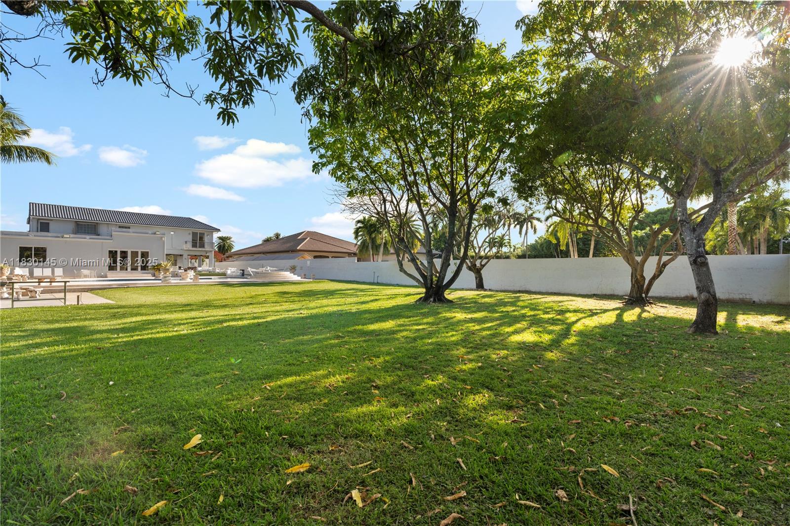13815 Southwest 38th Street Miami, FL 33175 - Photo 60 of 63 a view of yard with swimming pool and green space