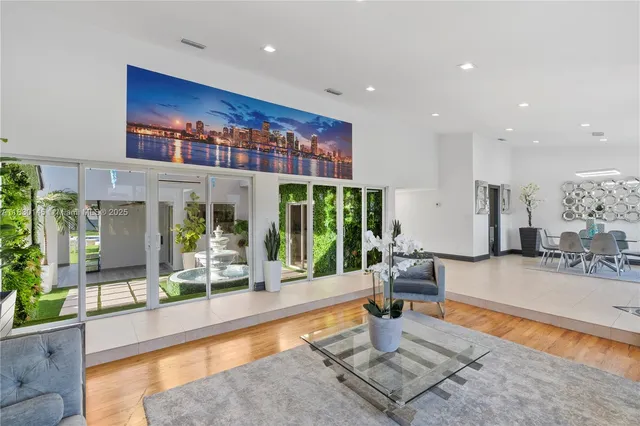 a kitchen with white cabinets and appliances