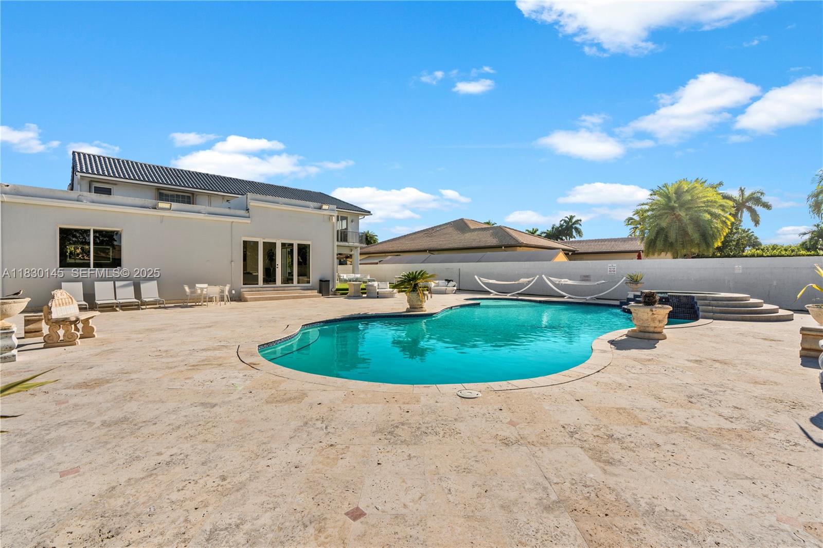 13815 Southwest 38th Street Miami, FL 33175 - Photo 69 of 75 a view of a swimming pool with a yard and plants