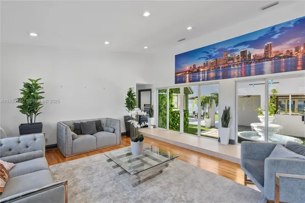 a living room with furniture and white walls