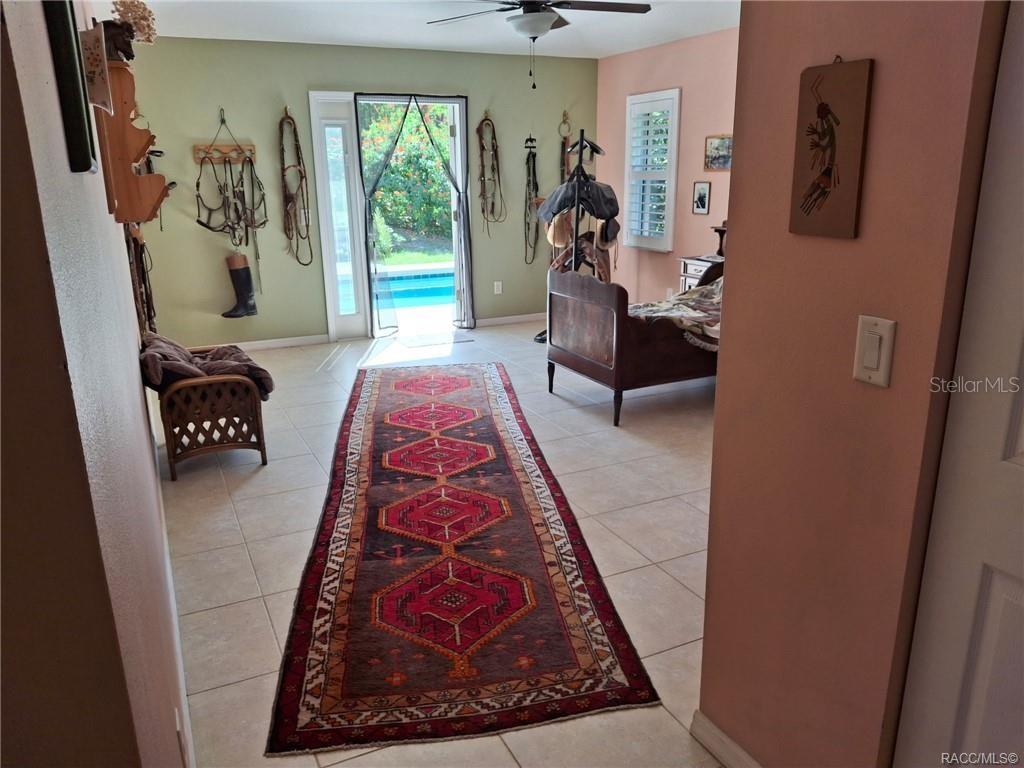 4295 North Bridge Road Beverly Hills, FL 34465 - Photo 21 of 79 a living room with furniture and a rug