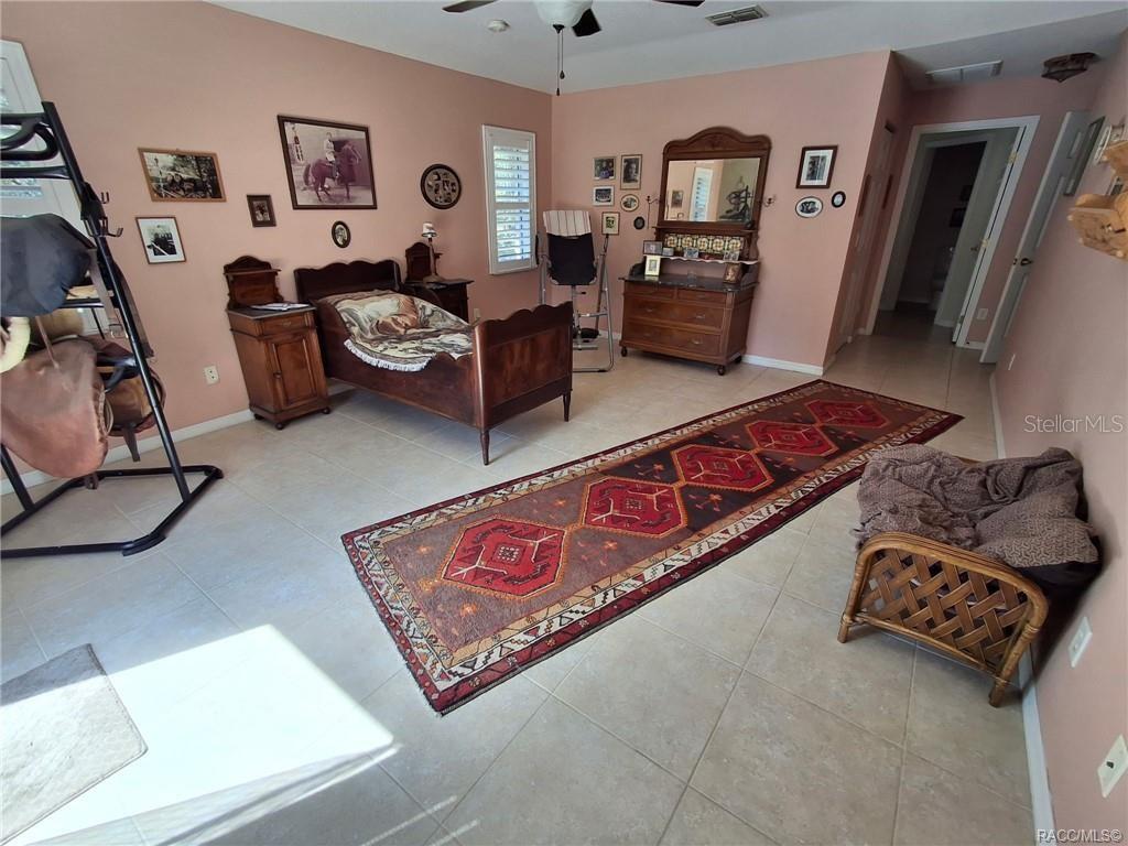 4295 North Bridge Road Beverly Hills, FL 34465 - Photo 22 of 79 a living room with furniture and a flat screen tv