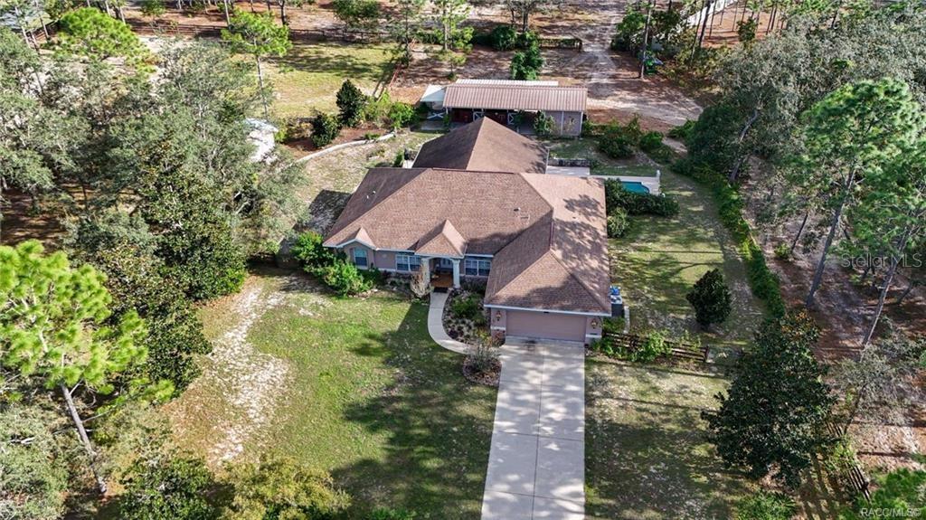 4295 North Bridge Road Beverly Hills, FL 34465 - Photo 3 of 79 an aerial view of a house with yard