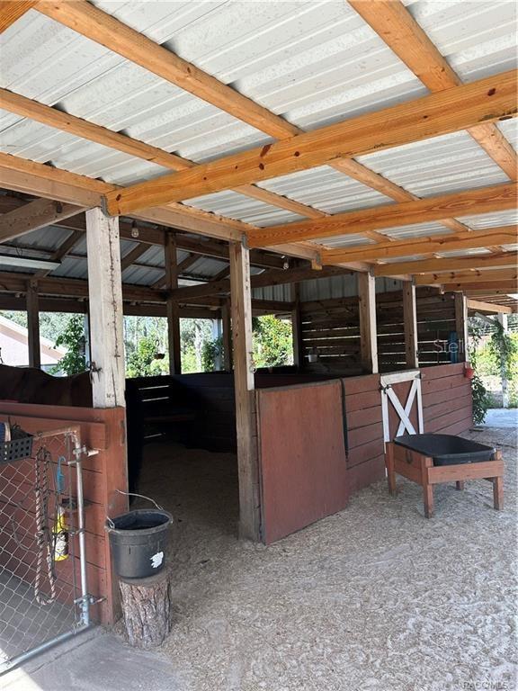4295 North Bridge Road Beverly Hills, FL 34465 - Photo 36 of 79 a view of a patio with a table and chairs