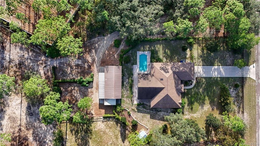 4295 North Bridge Road Beverly Hills, FL 34465 - Photo 52 of 79 an aerial view of house with yard and outdoor seating