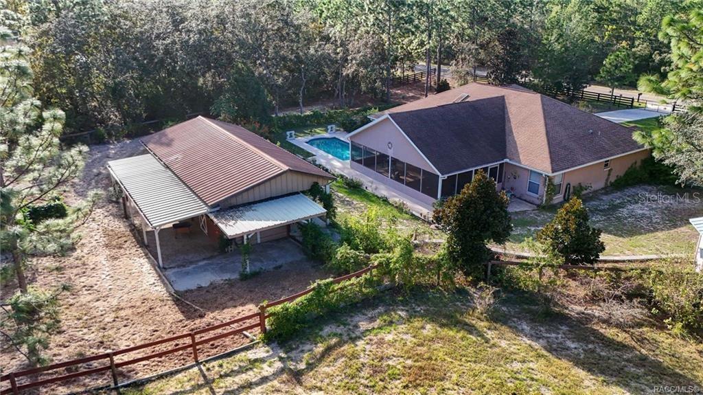 4295 North Bridge Road Beverly Hills, FL 34465 - Photo 55 of 79 a view of a house with a yard and sitting area