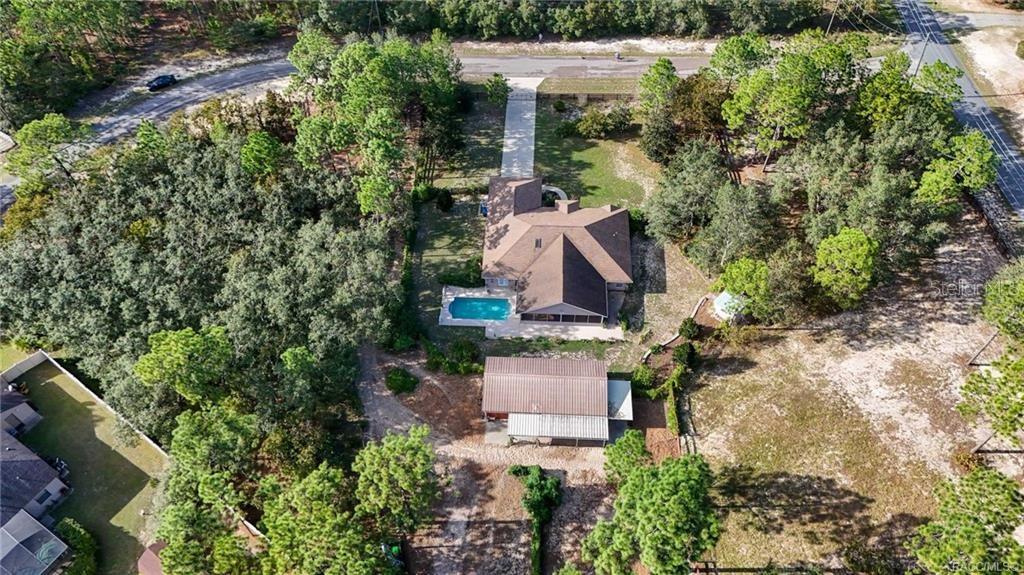 4295 North Bridge Road Beverly Hills, FL 34465 - Photo 56 of 79 an aerial view of a house with yard outdoor and lake view