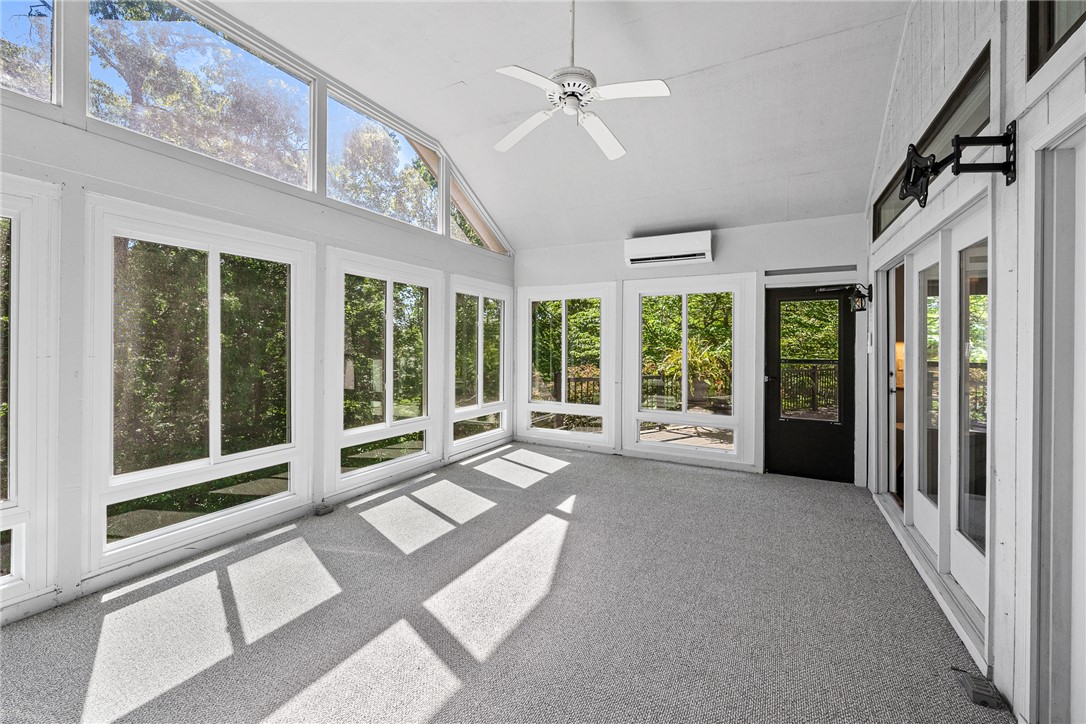 118 Beacon Ridge Circle Salem, SC 29676 - Photo 13 of 45 A tranquil sunroom with vaulted ceilings offers sweeping outdoor views and abundant natural light.
