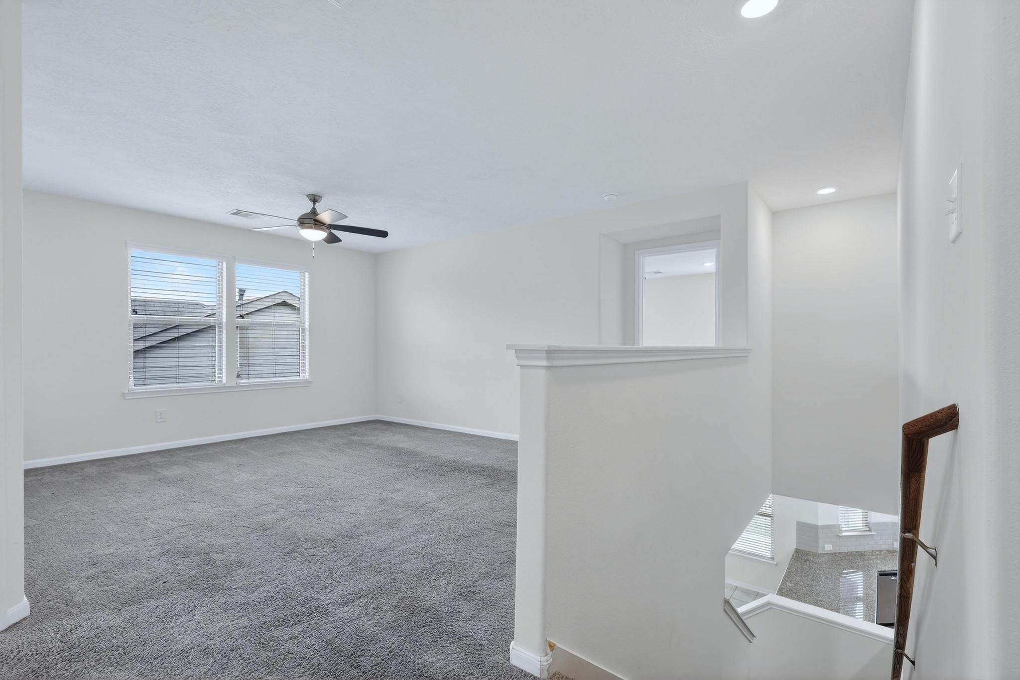 3322 Nila Creek Dr Spring Spring, TX 77373 - Photo 15 of 36 Upstairs game room or flex space offering a versatile area for entertainment, work, or relaxation.