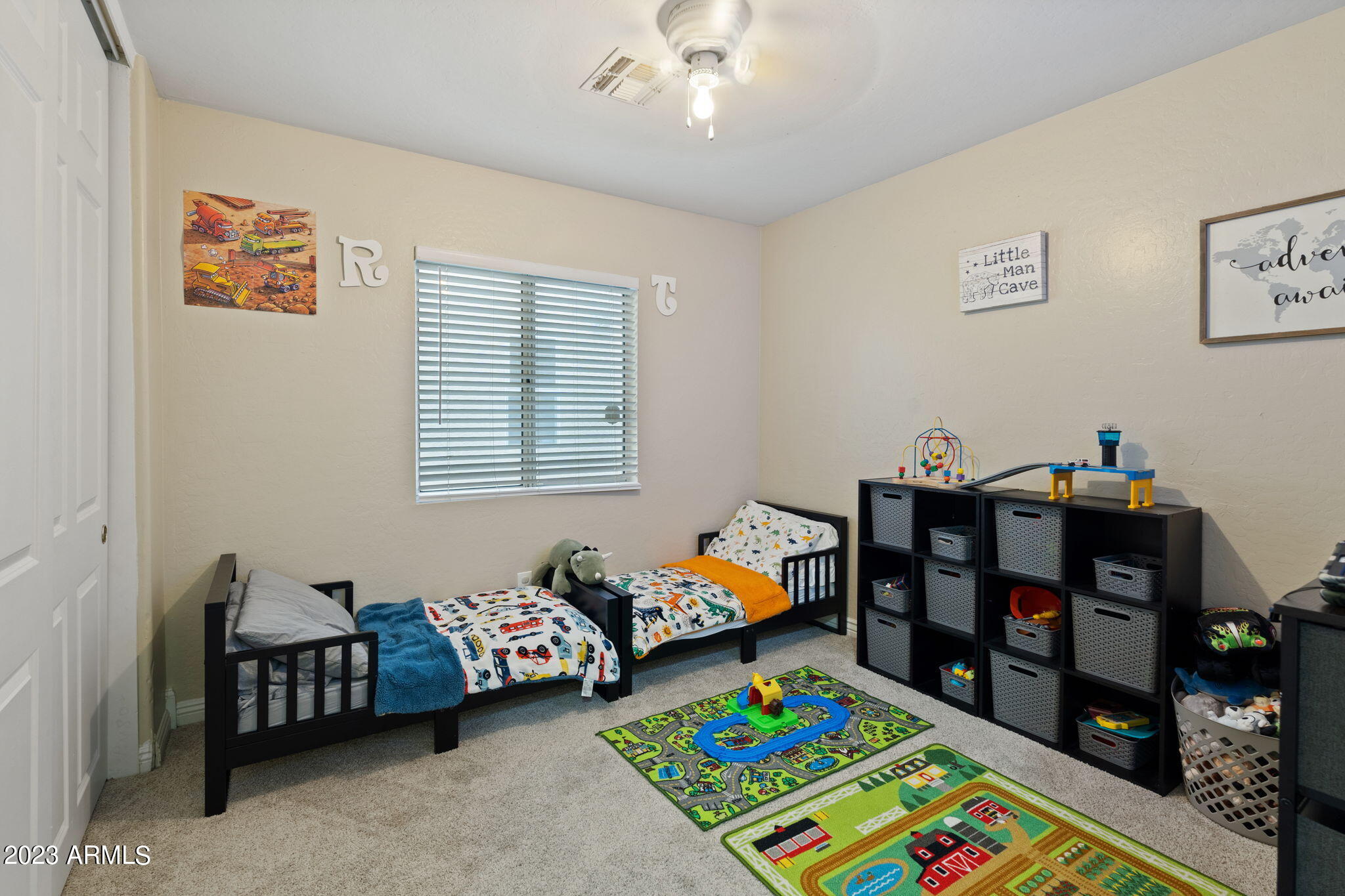 12537 West Bloomfield Road El Mirage, AZ 85335 - Photo 15 of 24 a bedroom with bed and a bookshelf