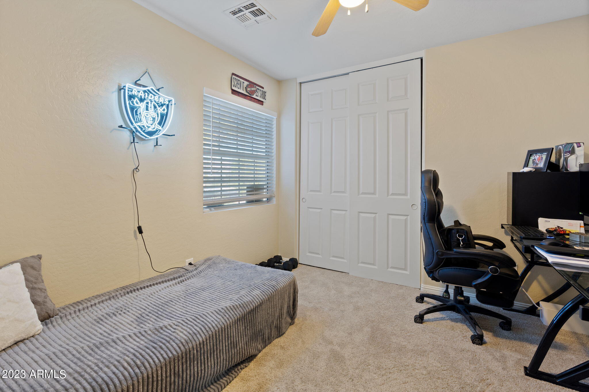 12537 West Bloomfield Road El Mirage, AZ 85335 - Photo 18 of 24 a bedroom with a workspace