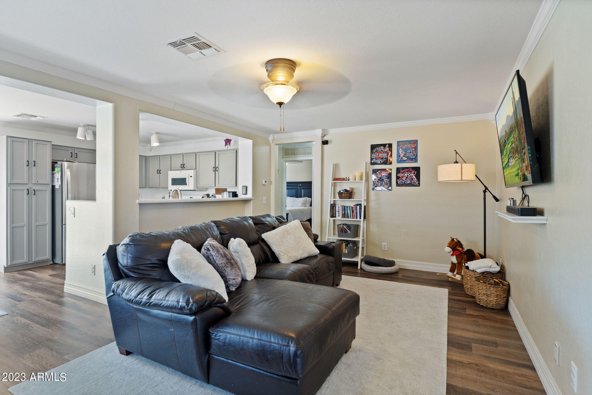 12537 West Bloomfield Road El Mirage, AZ 85335 - Photo 2 of 24 a living room with furniture and a flat screen tv