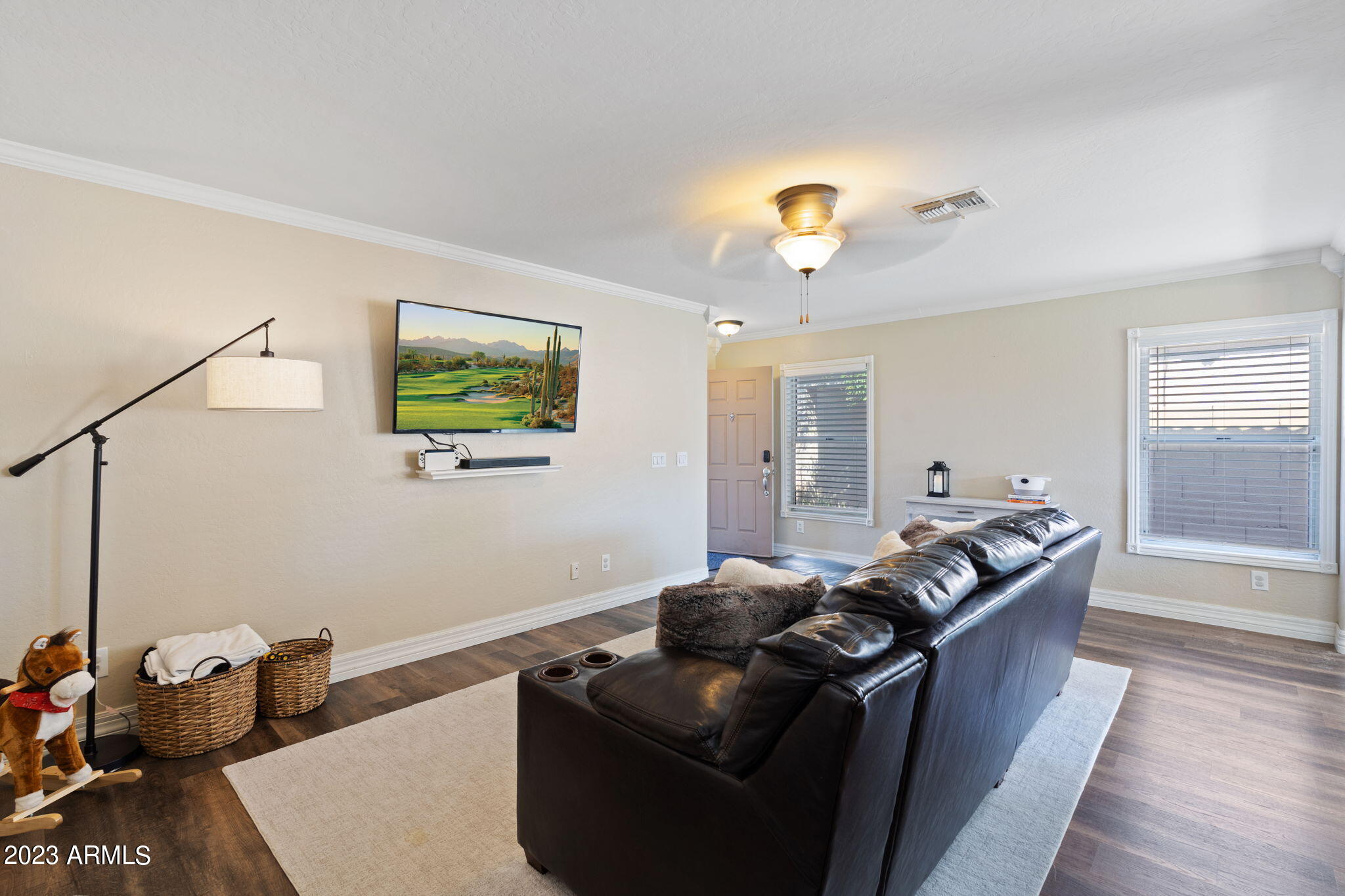 12537 West Bloomfield Road El Mirage, AZ 85335 - Photo 4 of 24 a living room with furniture and a chandelier