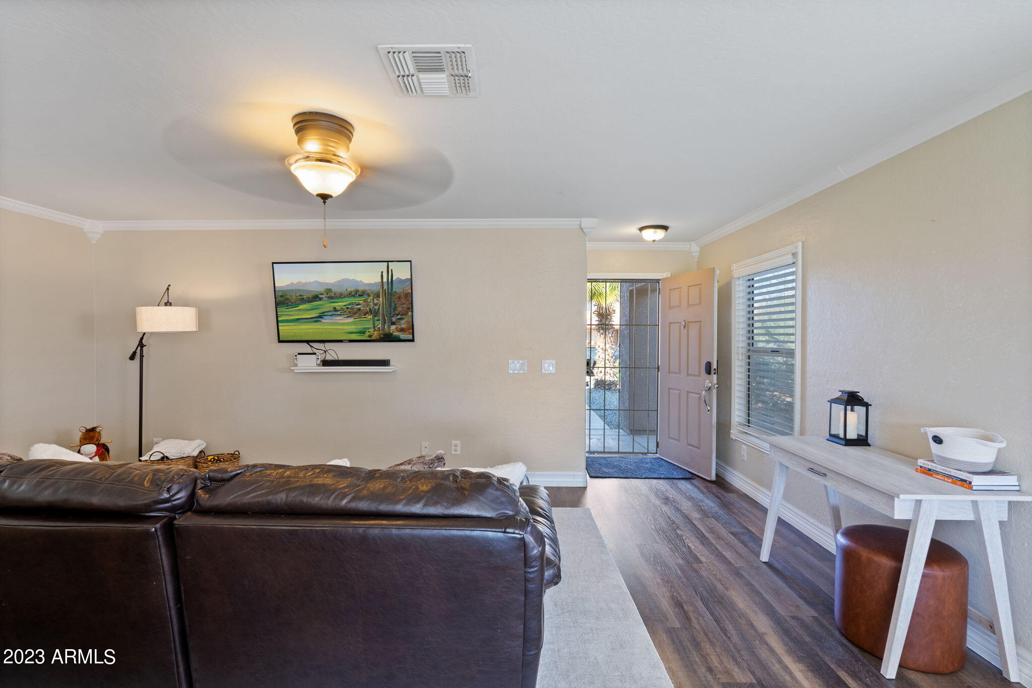 12537 West Bloomfield Road El Mirage, AZ 85335 - Photo 5 of 24 a living room with furniture and a wooden floor