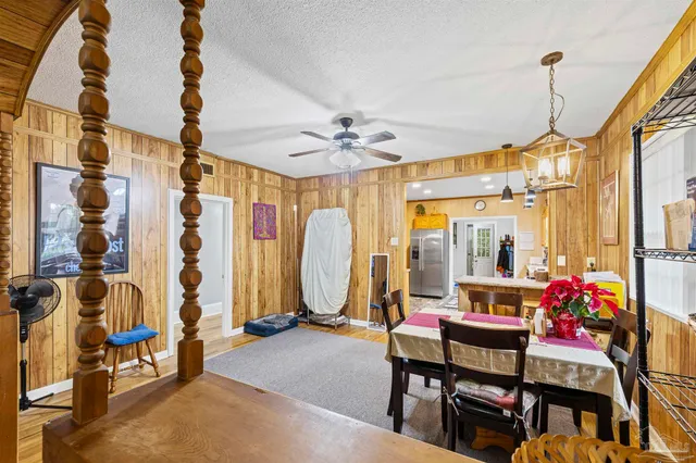a view of a livingroom with furniture and a window