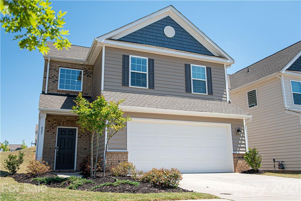 423 Triple Branch Trail Fort Mill, SC 29715 - Photo 1 of 29 a front view of a house with garden