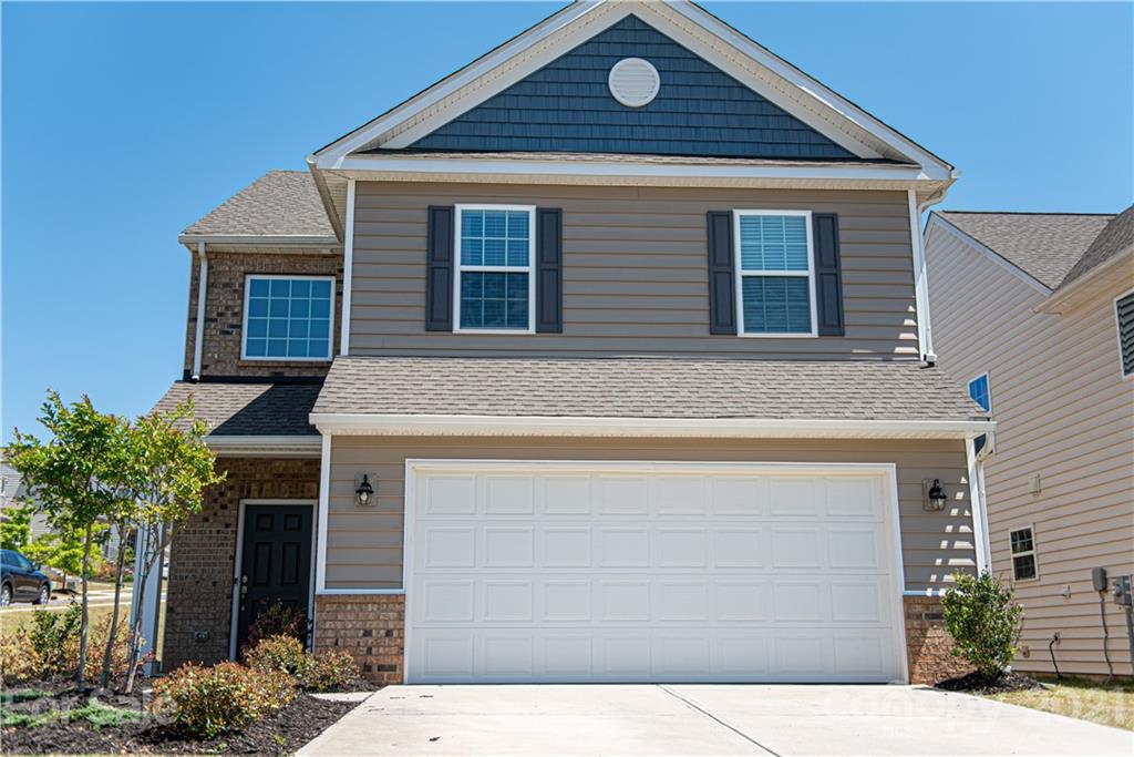 423 Triple Branch Trail Fort Mill, SC 29715 - Photo 2 of 29 a front view of a house with garden