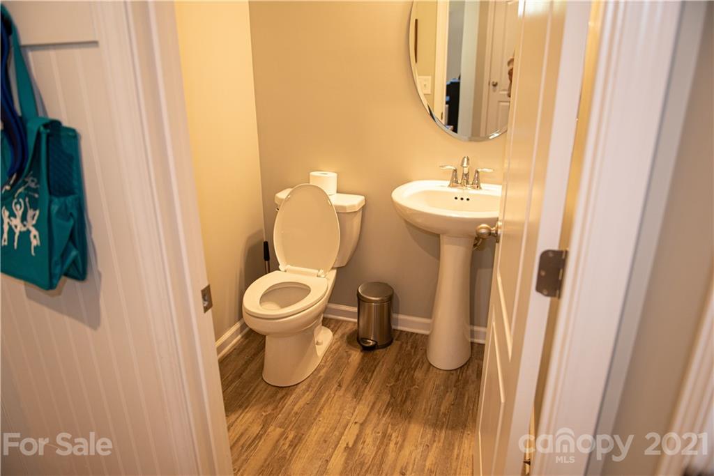 423 Triple Branch Trail Fort Mill, SC 29715 - Photo 13 of 29 a bathroom with a toilet a sink and a mirror
