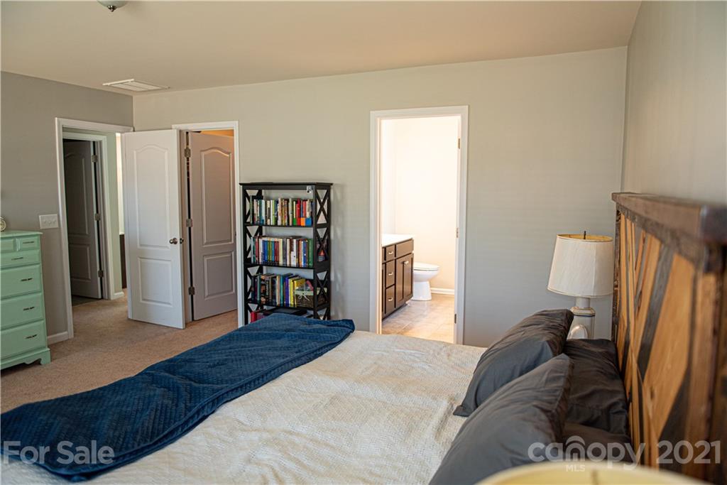 423 Triple Branch Trail Fort Mill, SC 29715 - Photo 16 of 29 a bedroom with a large bed and a window