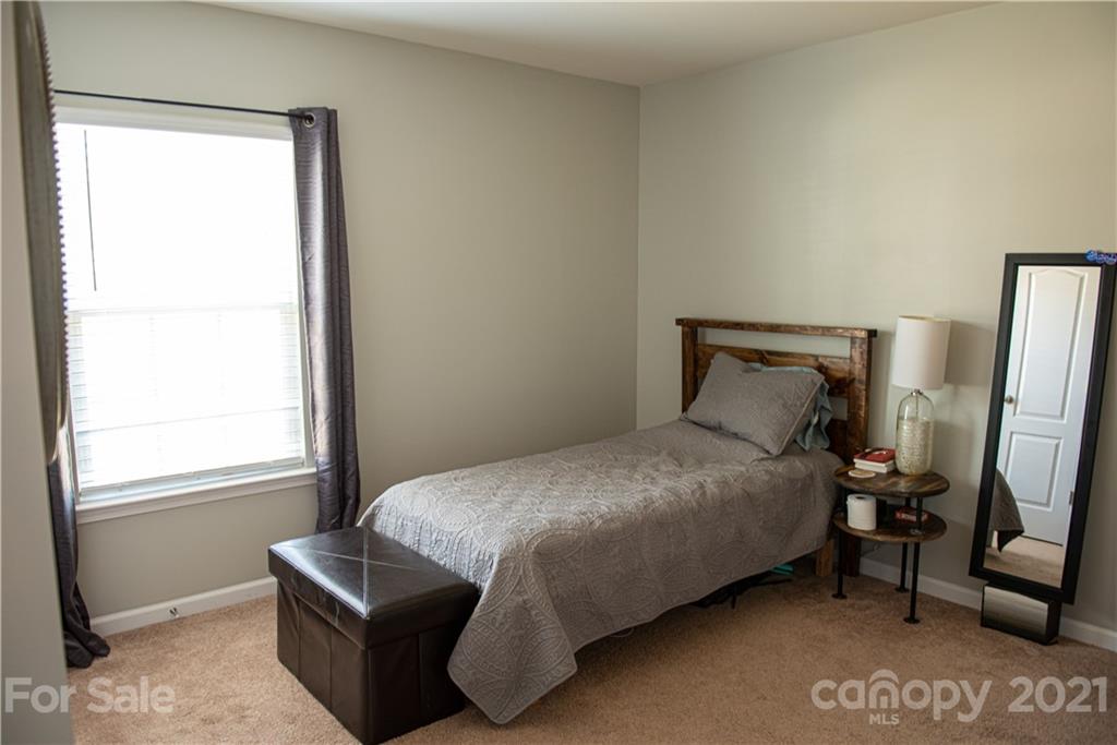 423 Triple Branch Trail Fort Mill, SC 29715 - Photo 19 of 29 a bedroom with a bed and a window