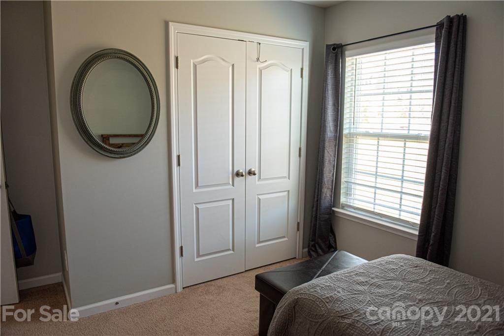 423 Triple Branch Trail Fort Mill, SC 29715 - Photo 20 of 29 a bedroom with a bed and a window