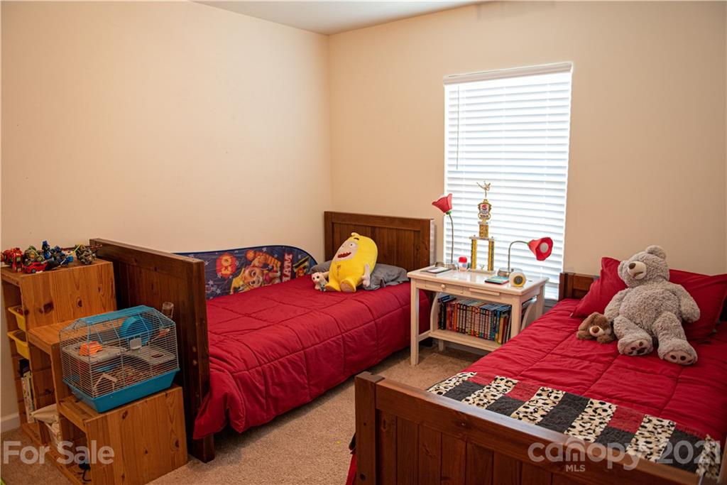 423 Triple Branch Trail Fort Mill, SC 29715 - Photo 22 of 29 a bedroom with two beds and a window