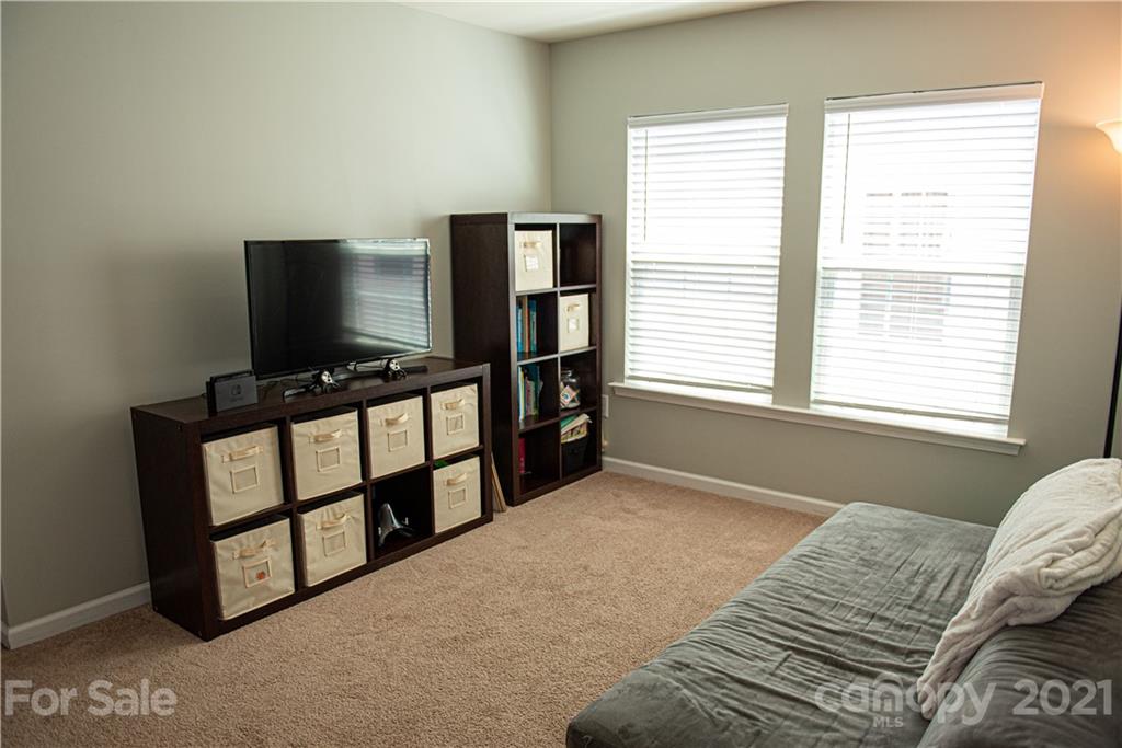 423 Triple Branch Trail Fort Mill, SC 29715 - Photo 26 of 29 a bedroom with furniture and flat screen tv