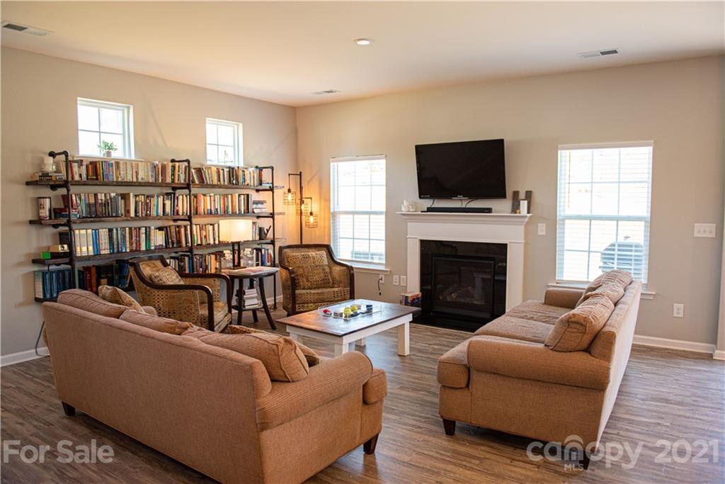 423 Triple Branch Trail Fort Mill, SC 29715 - Photo 5 of 29 a living room with furniture fireplace and flat screen tv