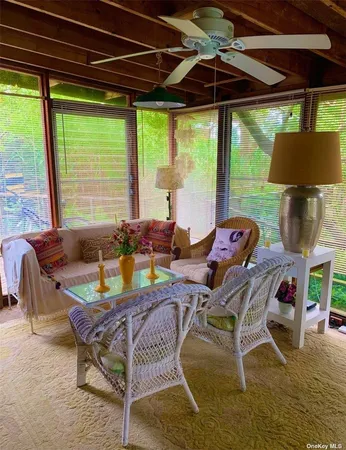 a bedroom with furniture and a window