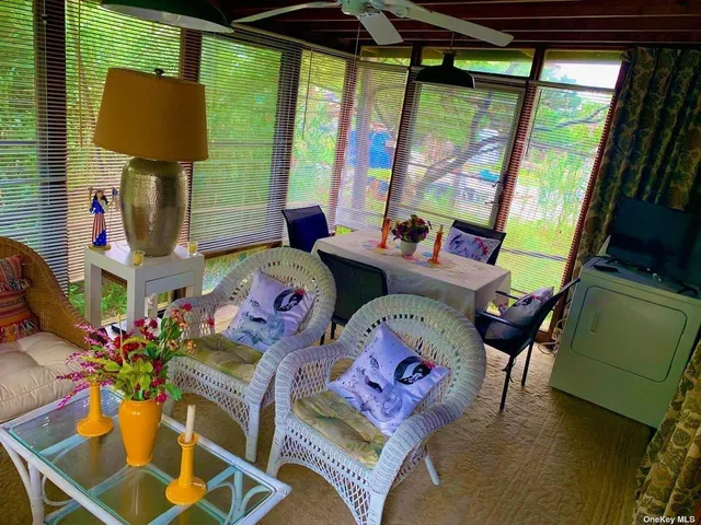 a view of a dining room with furniture window and outside view