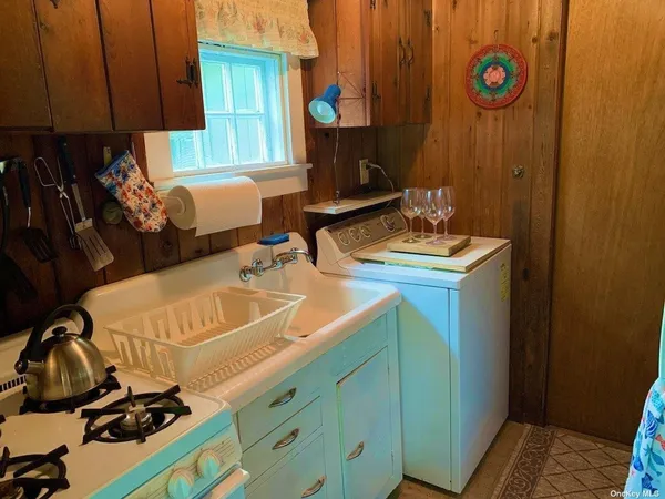 a room with wooden floor and furniture