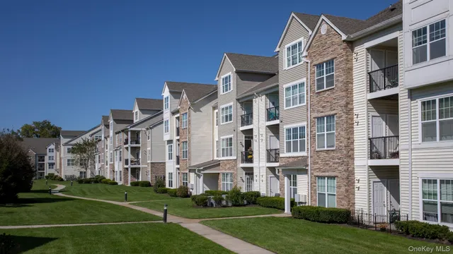 a view of a building with a yard