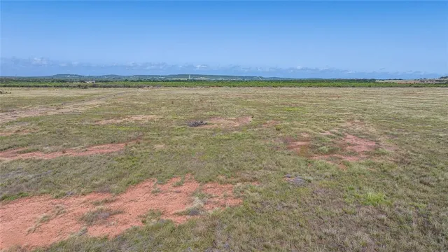 a view of an ocean beach and a yard
