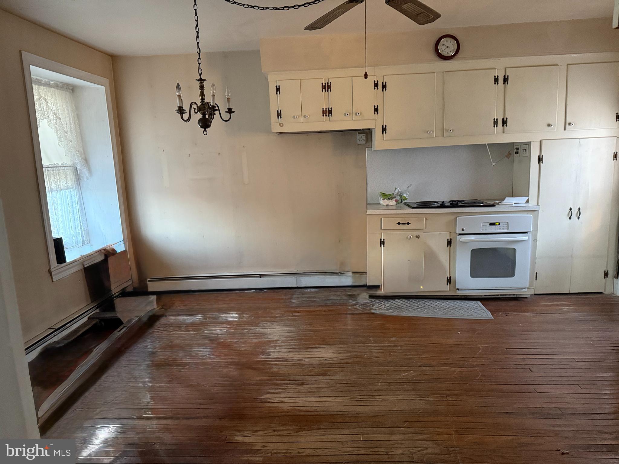 281 Matsonford Road Conshohocken, PA 19428 - Photo 14 of 16 a view of a kitchen with stove cabinets and wooden floor
