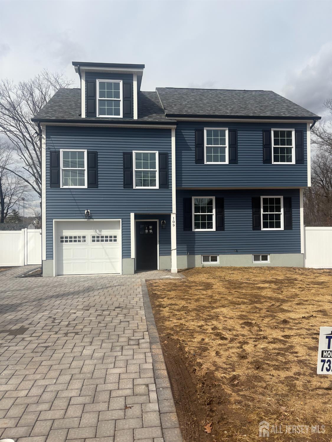 109 Pearl Place Dunellen, NJ 08812 - Photo 1 of 1 a front view of a house with a yard